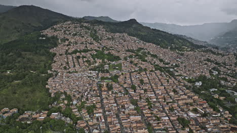 Medellin-Colombia-Aerial-v56-flyover-San-Miguel-and-La-Ladera-neighborhoods-capturing-residential-hillside-views-of-Comuna-8-and-Villa-Hermosa-on-hilly-terrain---Shot-with-Mavic-3-Cine---November-2022