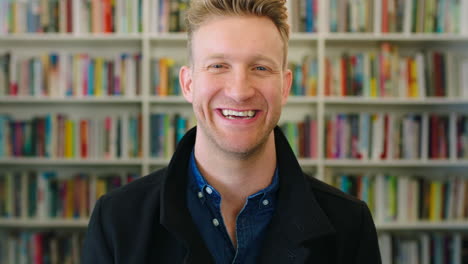 a happy male librarian that enjoys his job smiling