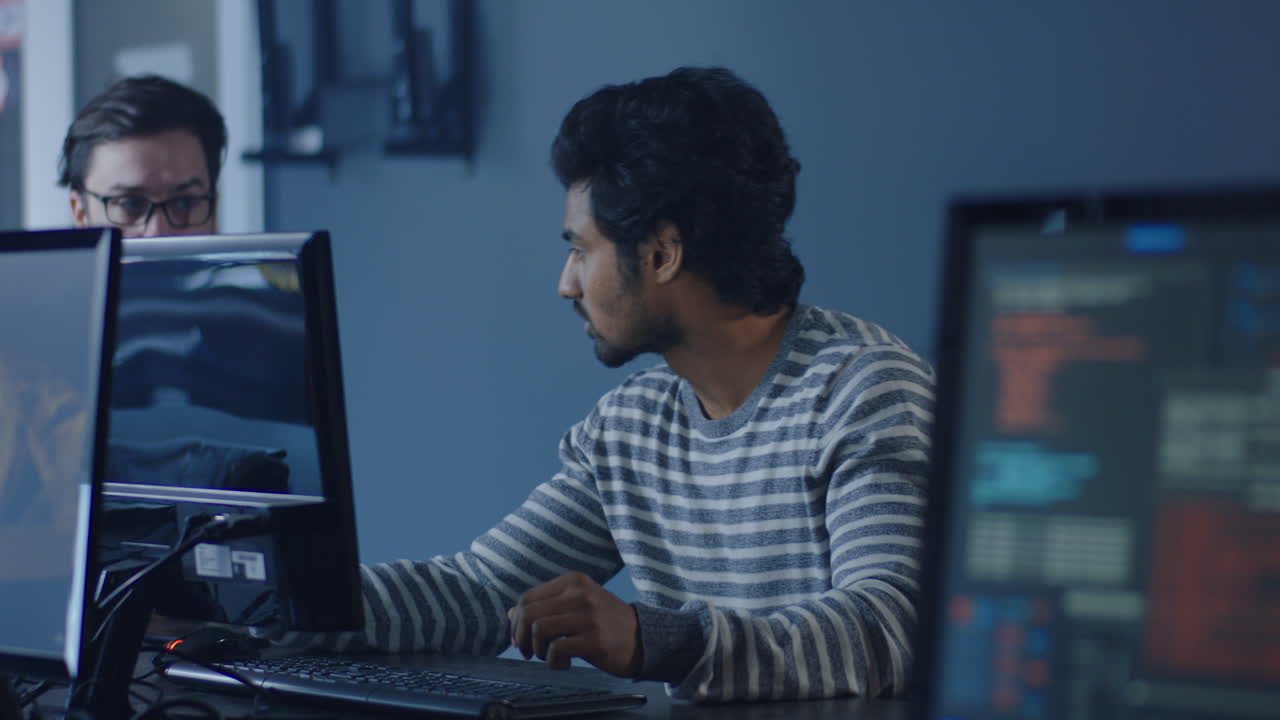 Programmers Working at Desk