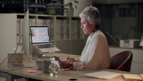 woman working at desk with computer and credit card