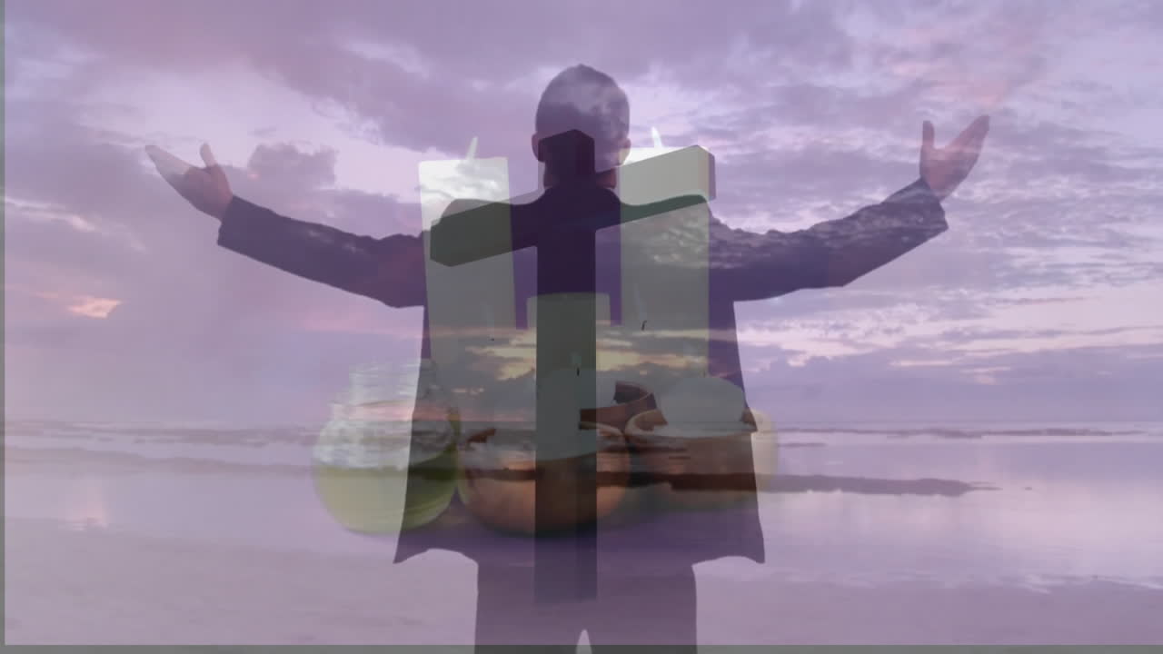 silhouette man raising arms on beach sunset, with animated cross and bowl icons showing health