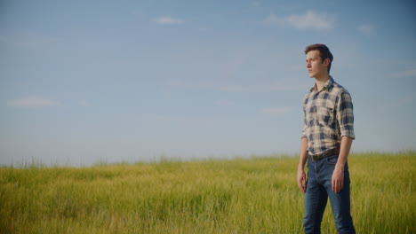 man walking in a wheat field