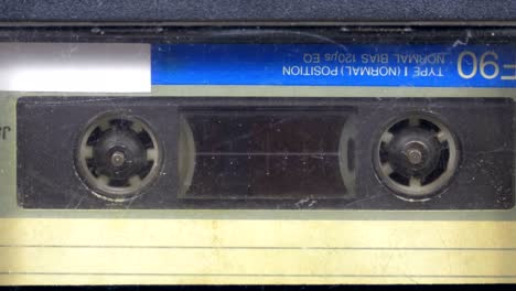 the vintage audio cassette in the tape recorder rotates