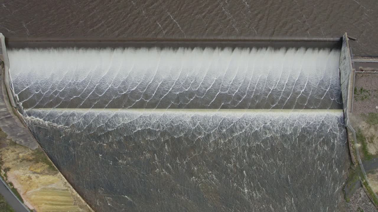 View of water spilling over the Upper Coliban Reservoir spillway, central Victoria, Australia. October, 2022.