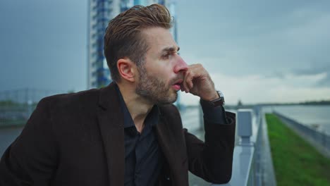 thoughtful man by the river