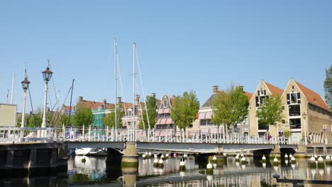 dutch canal town with bridge and houses