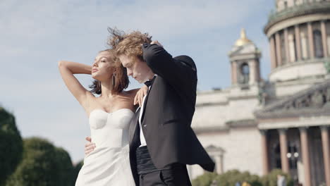 elegant wedding couple in front of a church