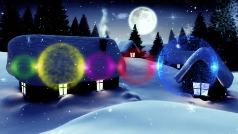 Animation-of-christmas-baubles-over-houses-in-winter-scenery