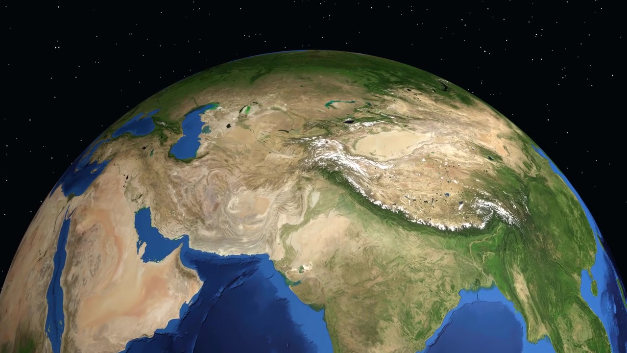 Digital animation zooms from deep space to a labeled location marker in Jalalabad, Afghanistan