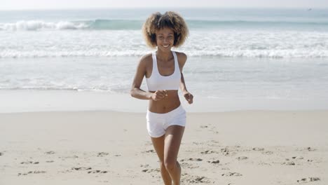 Sporty-Woman-Running-At-The-Beach