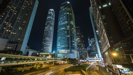 timelapse view of modern office buildings and night traffic in the financial district of hong kong, china