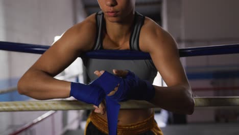 mixed race woman wrapping her hands