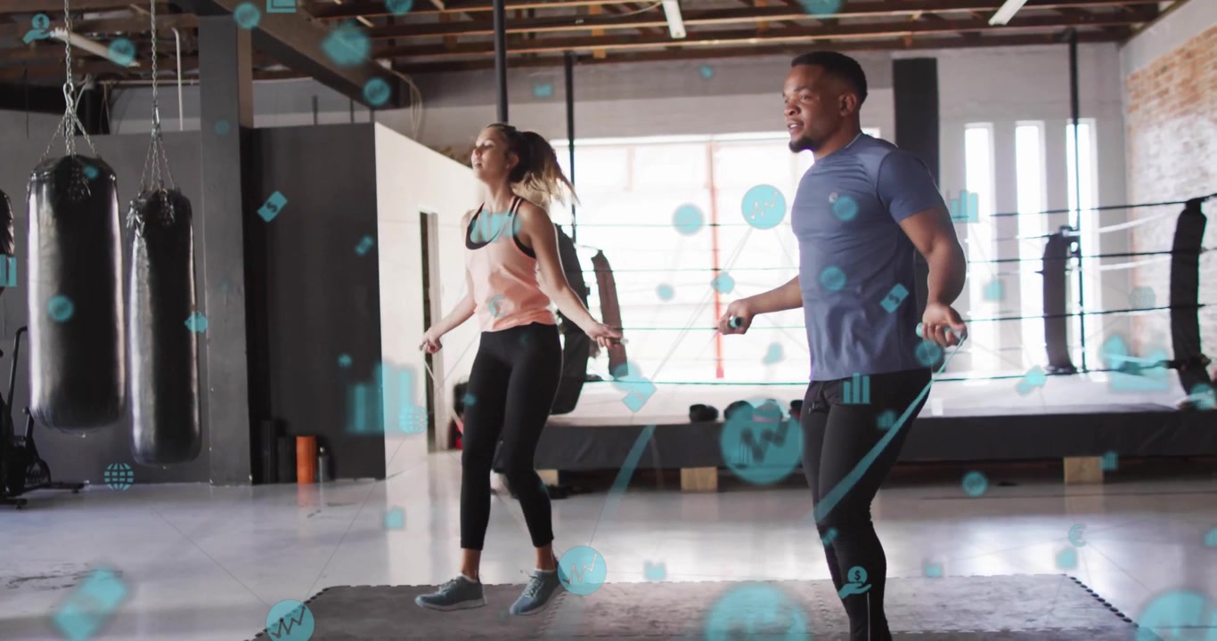 Man and woman swinging ropes initiating skipping for fitness tracking with animated data icons