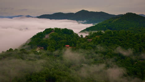 fog rolls like waves through the smokies in this aerial capture