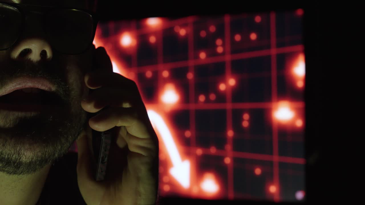 A frustrated investor yells on the phone after seeing collapsing market charts. Concept of stock panic, crypto losses, and emotional trading stress