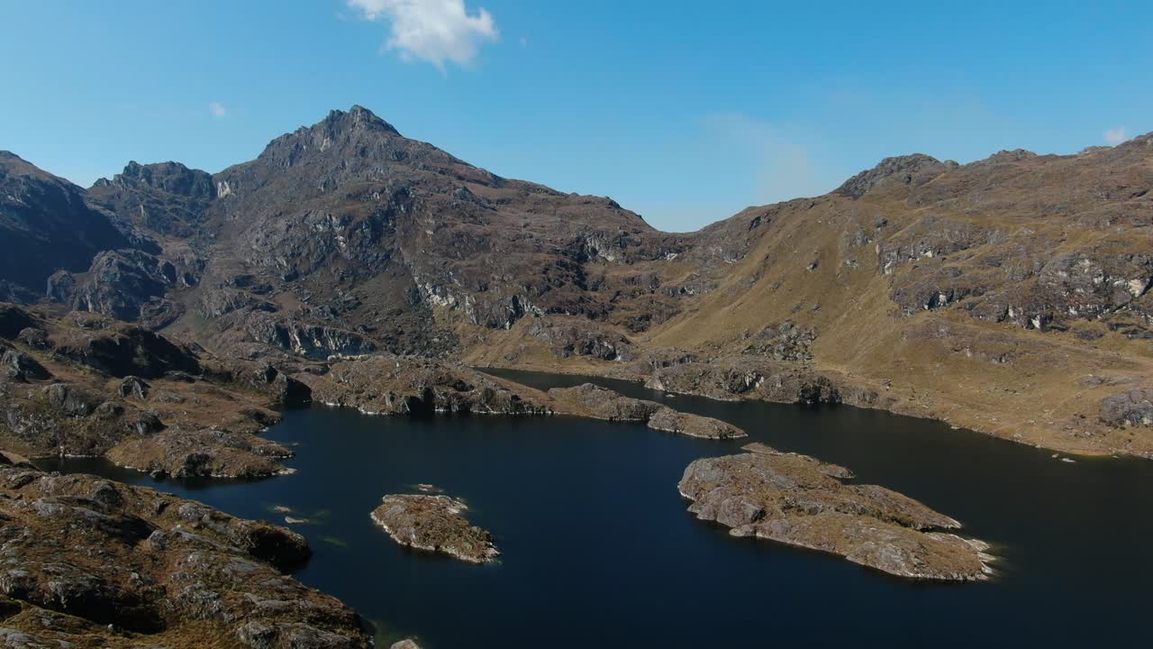 4k aerial drone footage over the 4th lagoon of Pichgacocha from Ambo, Huanuco, Peru in the Andes mountains. Dolly in and pan from right to left wide angle shot.