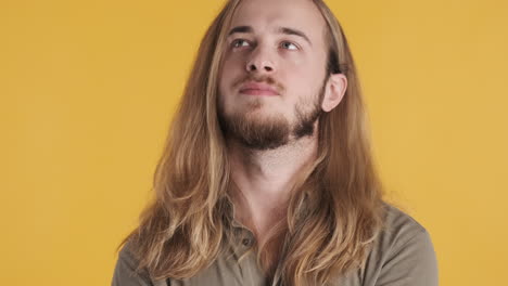 caucasian young man bored in front of the camera.