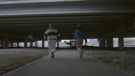 two parkourists running and doing side flips