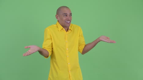 portrait of happy handsome bald businessman