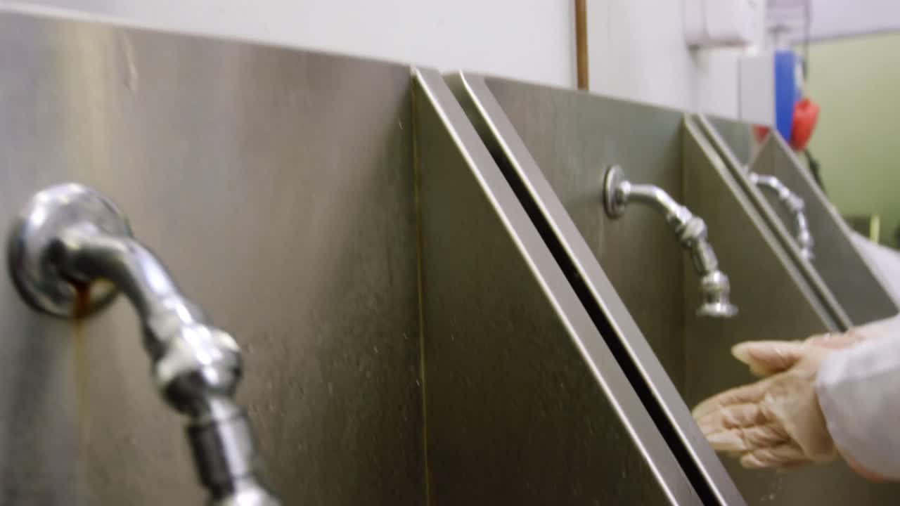 Butcher washing hands