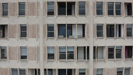 Detailed-close-up-view-of-Velasca-Tower-in-Milan,-aerial-fly-backward