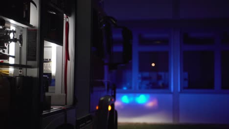 firetruck with blue light in darkness