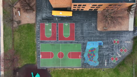 top down aerial of school playground and school bus