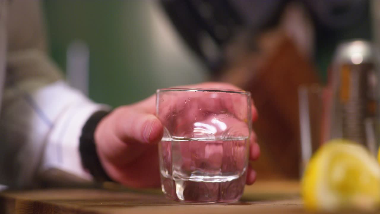 Man makes vodka cranberry mixed drink