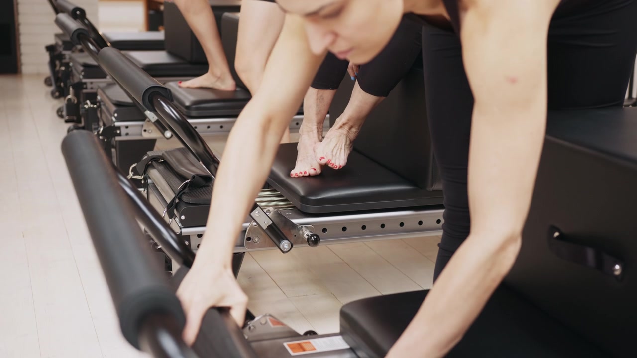 Pilates reformer springs on hooks in pilates fitness studio rehabilitation healthy lifestyle