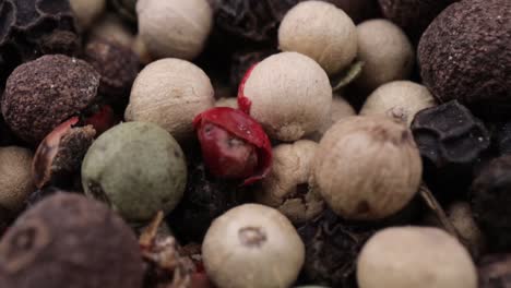 macro close-up mixed peppercorns. dry mix peppercorns close up