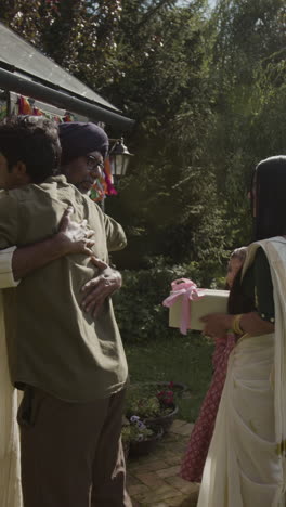 a heartwarming family celebration with gifts and hugs in a festive garden