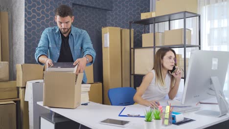 online bookstore couple preparing customer orders.