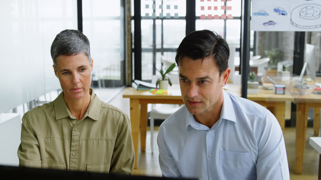 Executives working at desk in office 4k