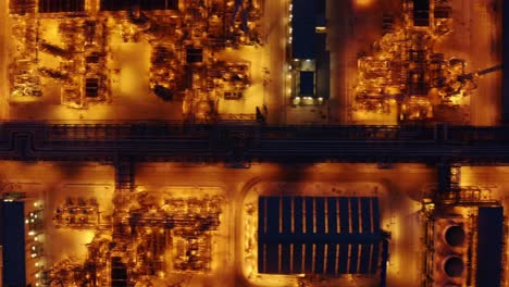 aerial top view of petrochemical plant illuminated at night