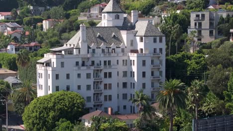 famous chateau marmont hotel on sunset boulevard in los angeles, aerial push in view