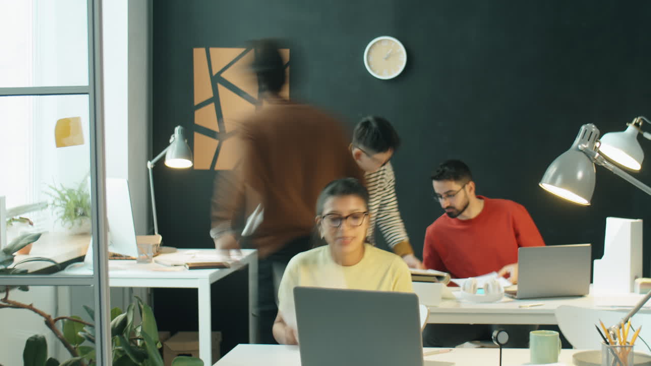 Time Lapse of Multiethnic Colleagues Working in Office