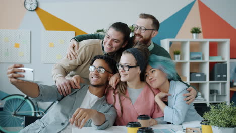 team selfie in a modern office