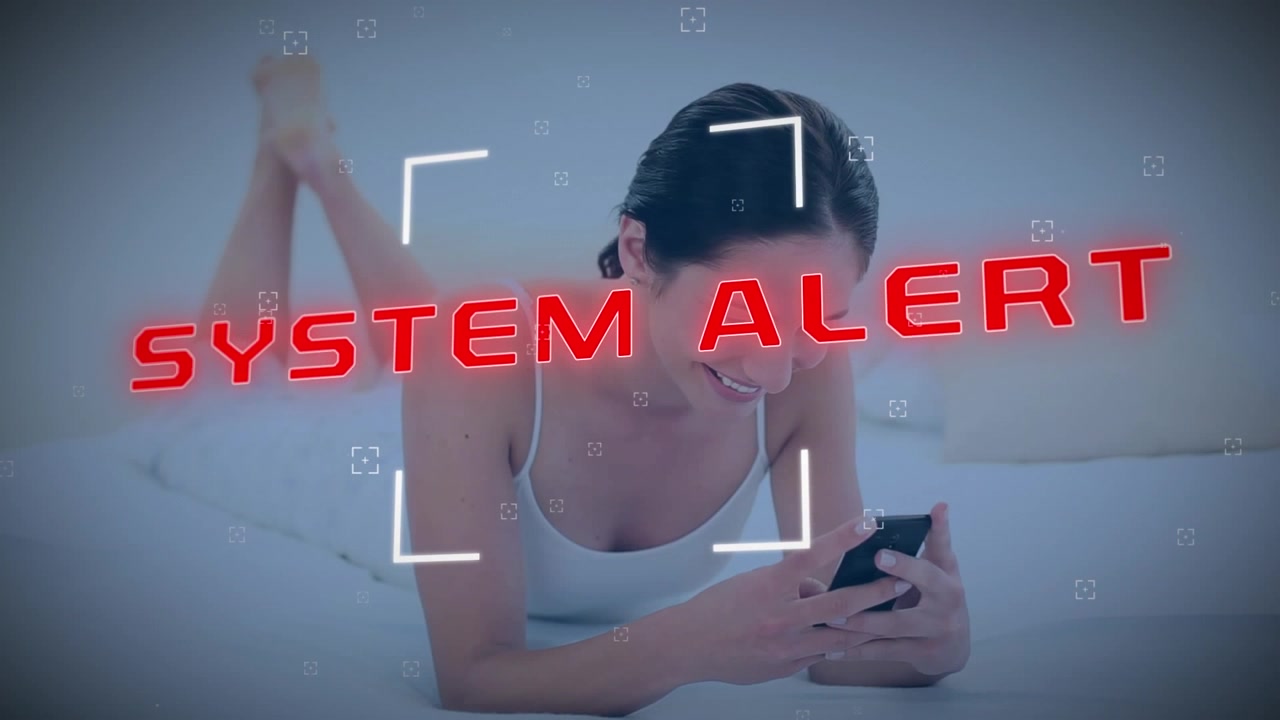 Animation of system alert text over caucasian woman using smartphone