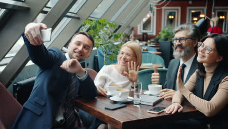 business team selfie in cafe