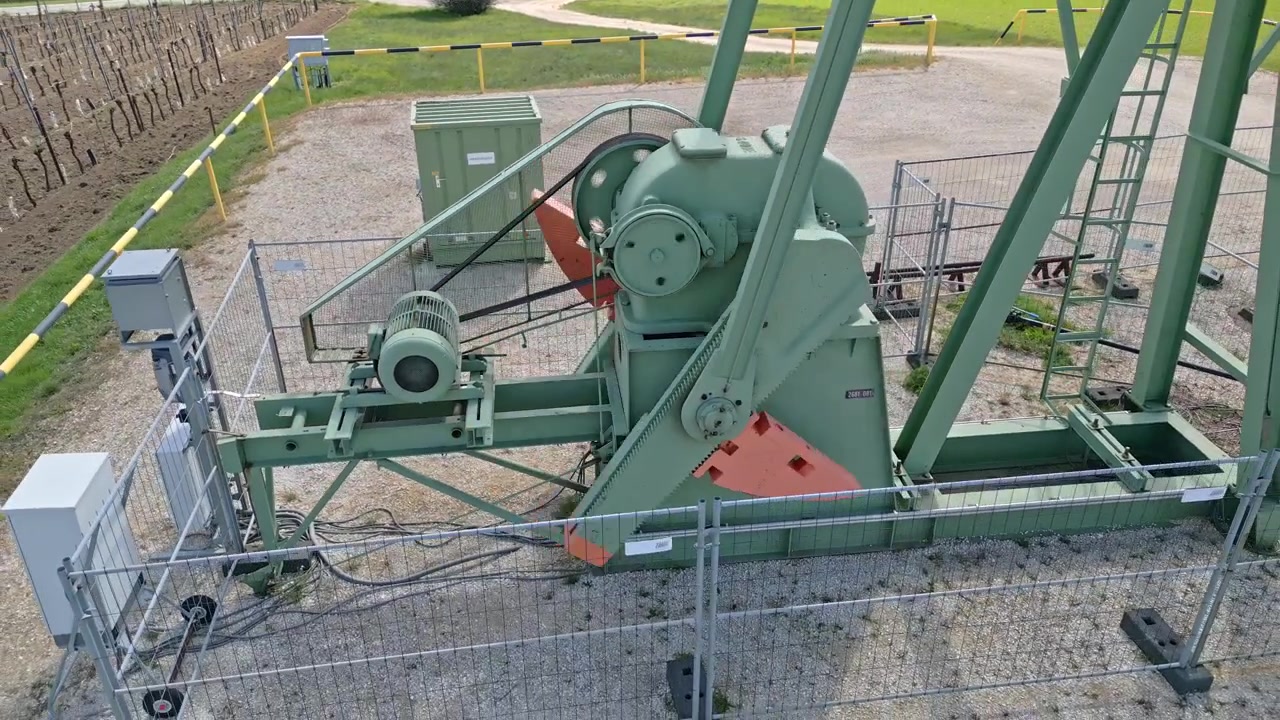 Oilfield Machine At Work Drilling And Extracting Oil. closeup, zoom-out