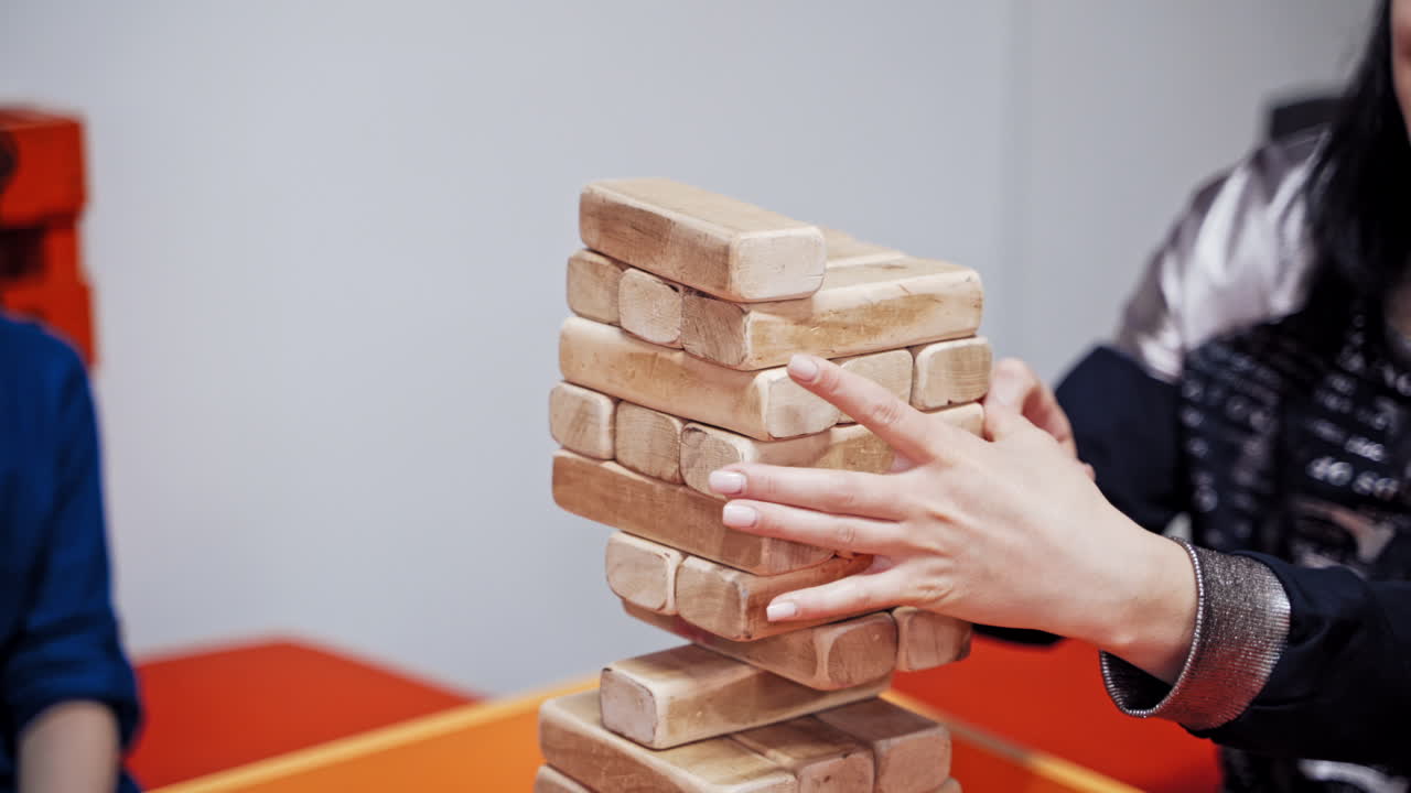 Science exhibition museum. Young boy playing a jenga