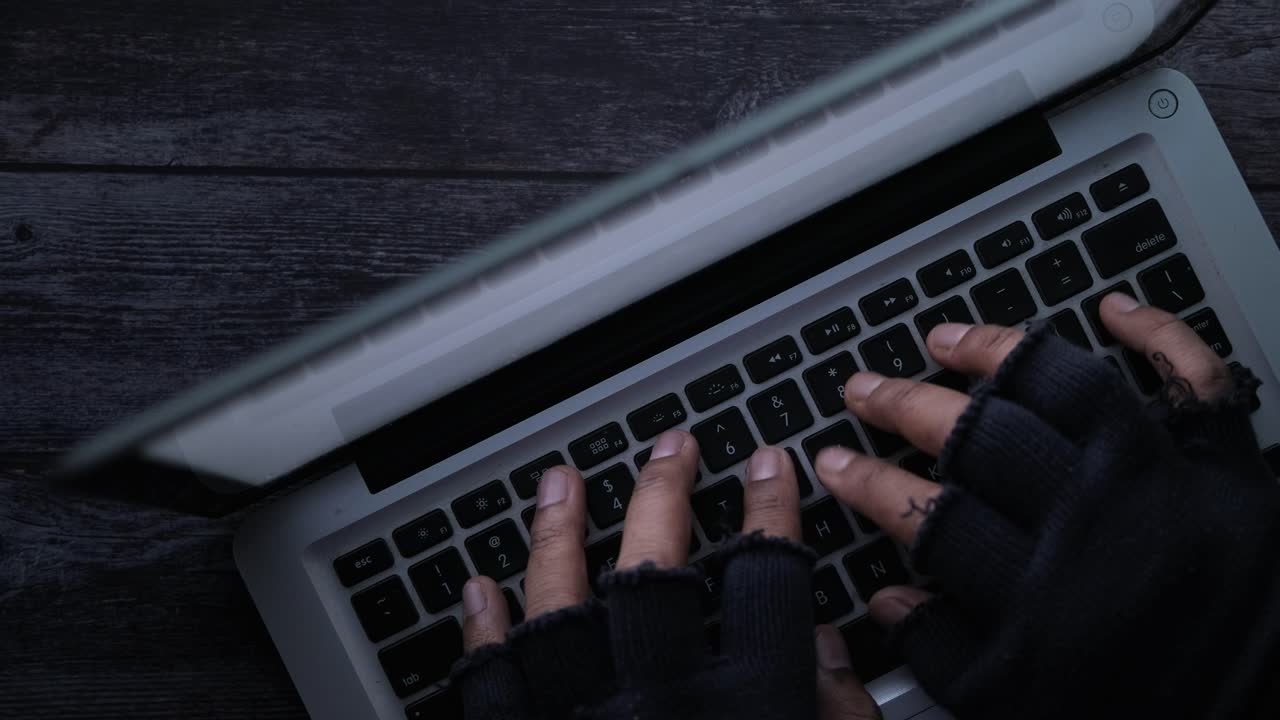 Hands Typing on a Laptop - Potential Hacking Activity