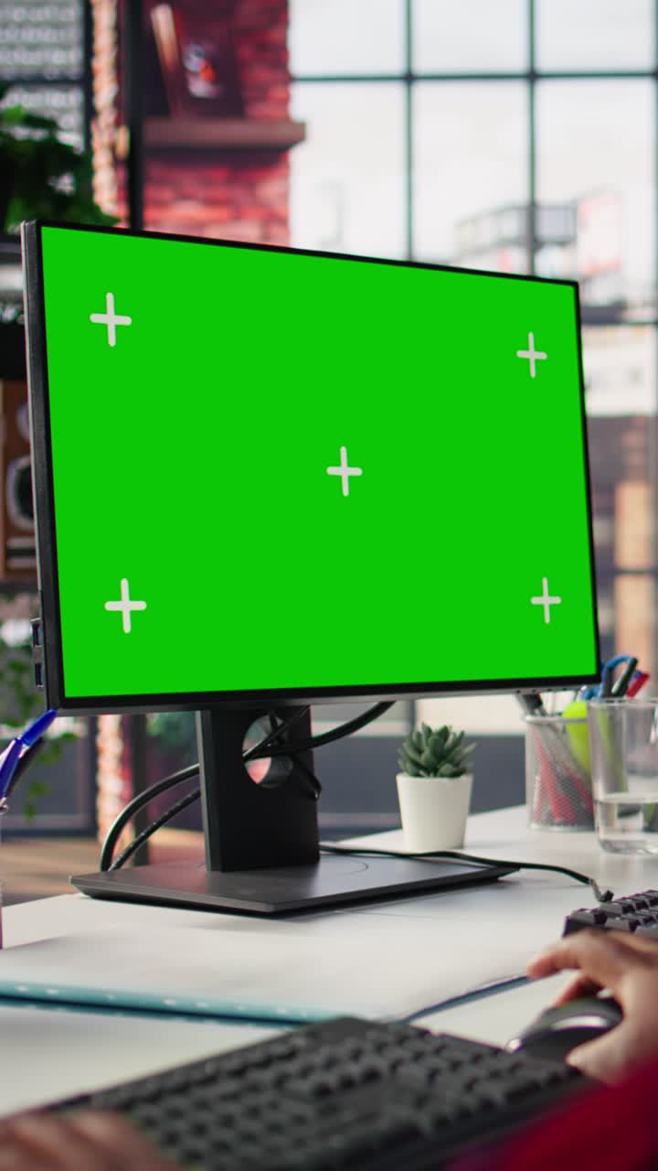 Vertical video Call center employee working on green screen mockup PC