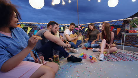 rooftop party friends enjoying pizza