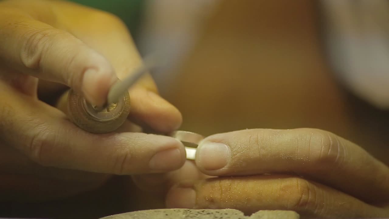Italian Goldsmith at work building an engagement or a wedding ring
