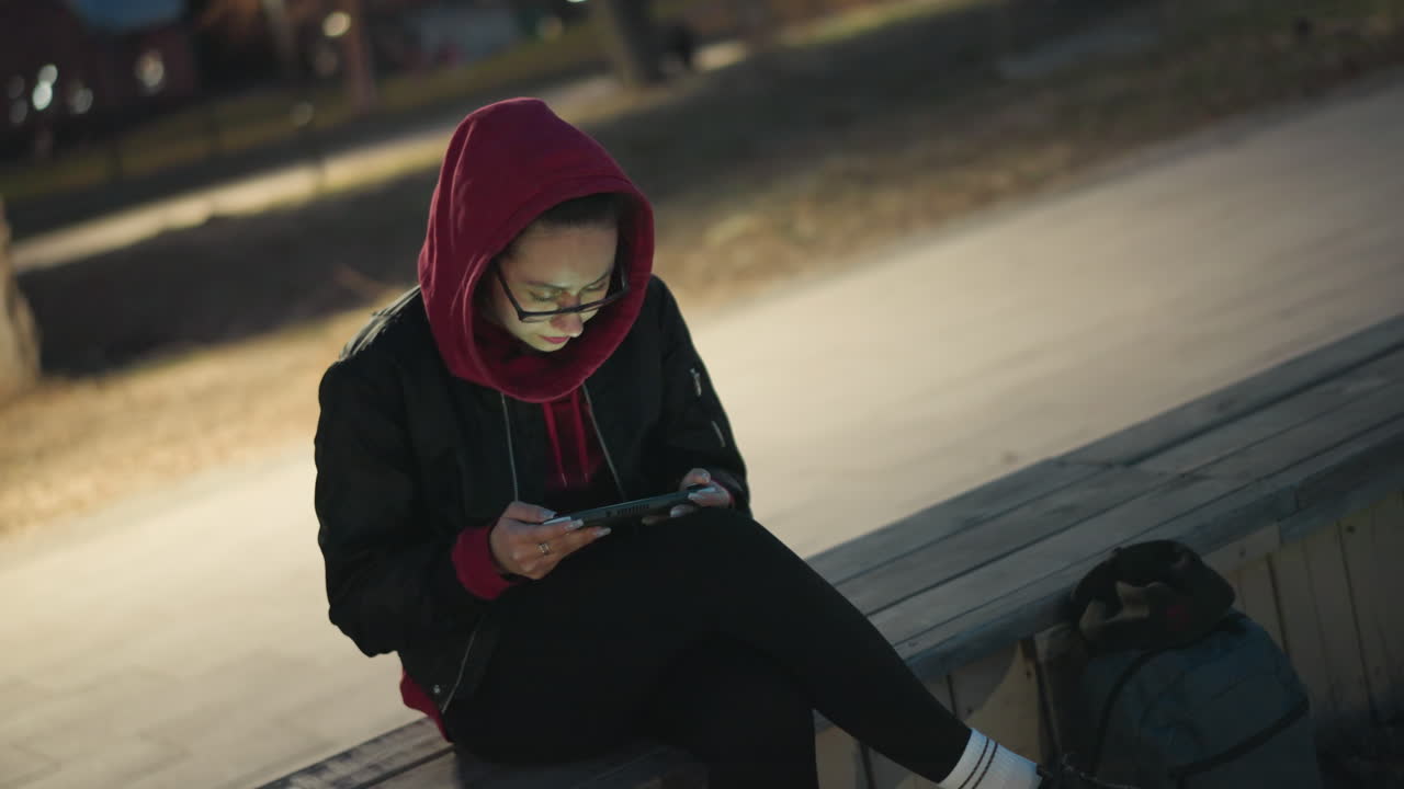 Urban Lady Relaxing, Woman In City Using Device, Female Urban Inhabitant Taking Break With Her Mobile Phone, City Woman Relaxing And Engaging With Her Smartphone In Outdoor Environment
