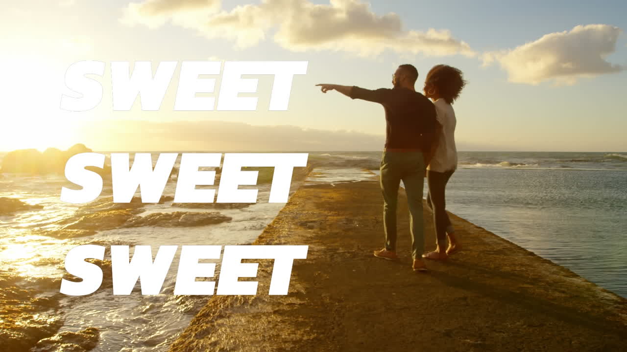 Animation of sweet text over couple on the beach