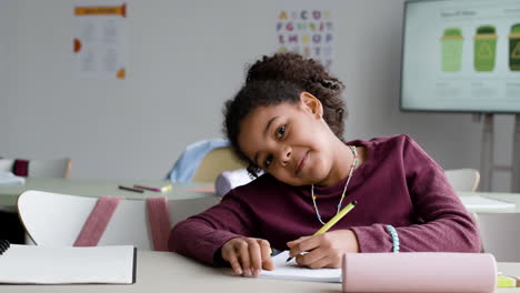 girl writing in class