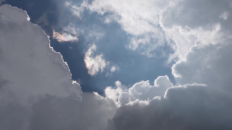 A ray of light peeks out from behind the clouds.