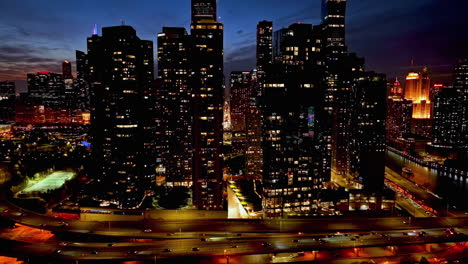 aerial view of traffic in front of the new eastside, colorful evening in chicago